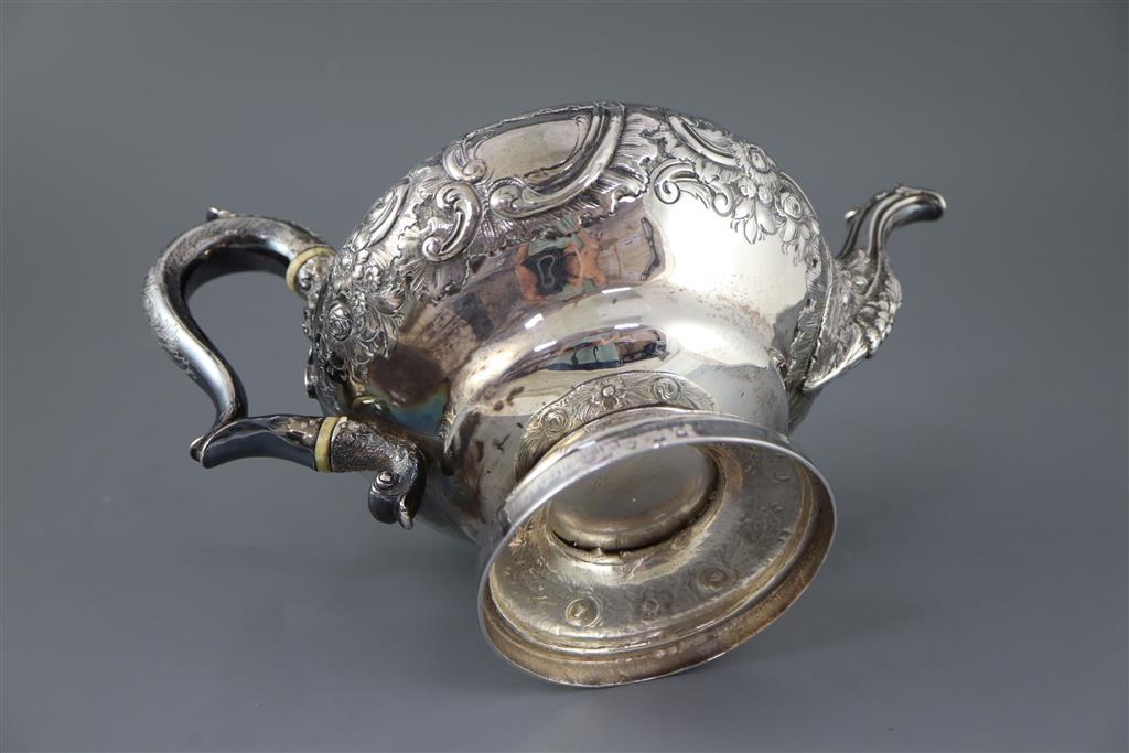 A George IV? silver pedestal teapot with thistle finial, marks rubbed,